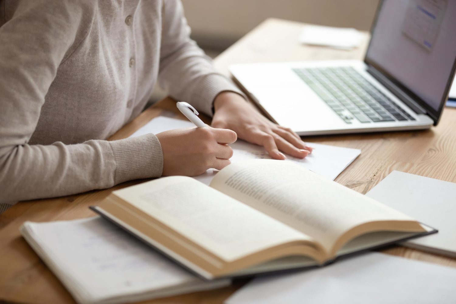 Close Up Female Student Writing Down Notes