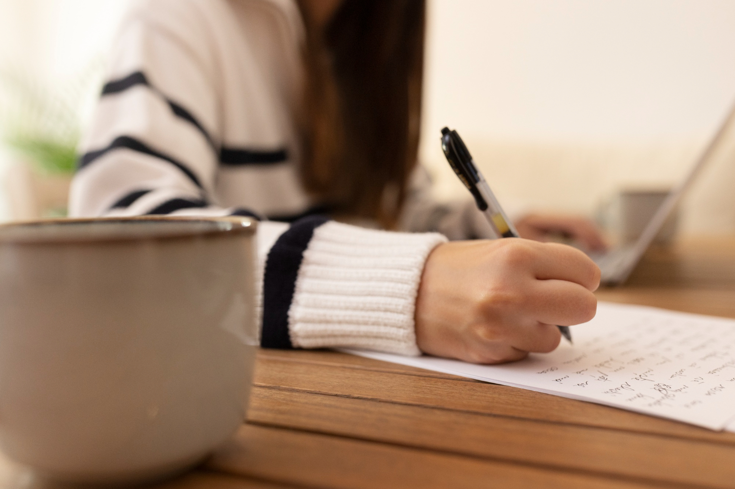 Close-Up Of Girl Writing